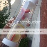 White Glasstic Flip Cap Shatterproof Glass Water Bottle with fruit infused water.