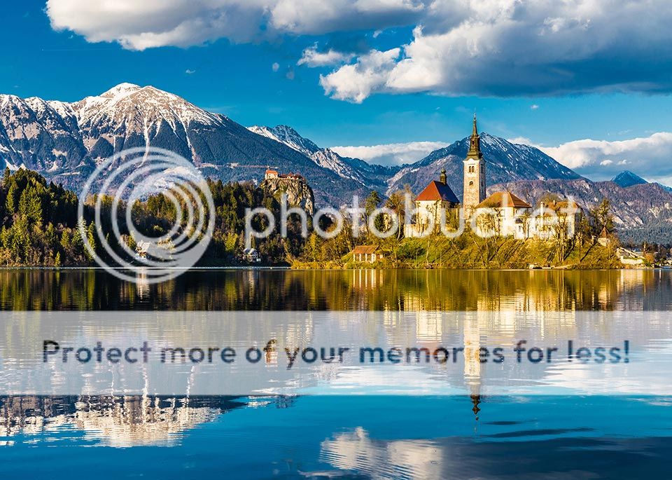 Atop a small island in the middle of Lake Bled, the Baroque Church of the Assumption can be reached by traditional Slovenian pletna boat. © ZM Photo / Shutterstock - Best In Travel 2018 by Lonely Planet